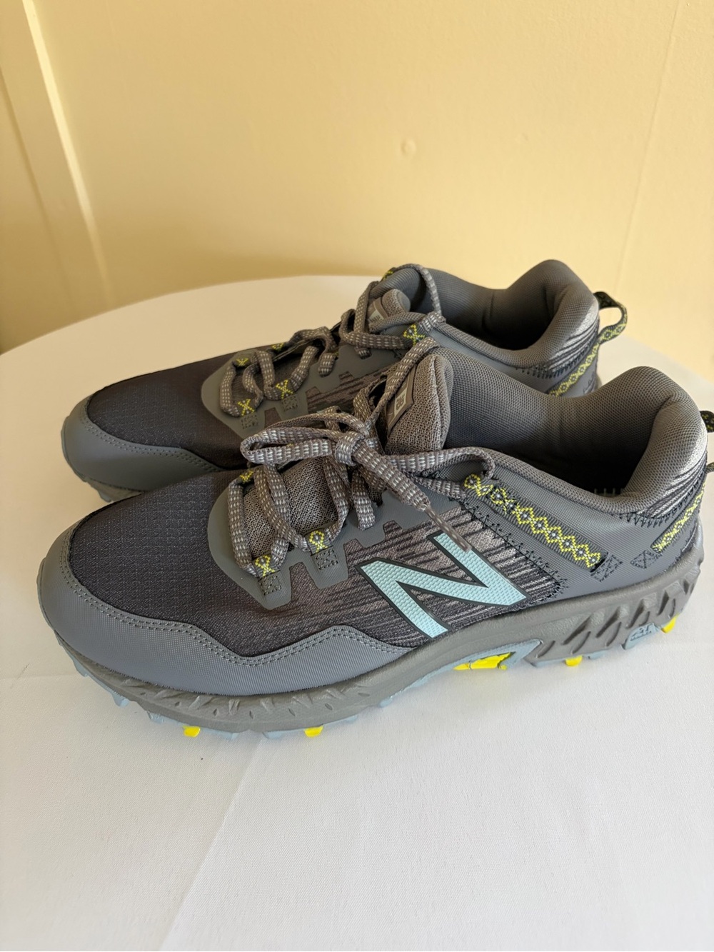 New Balance Women’s Gray Trail Sneakers with Light Blue Logo and Yellow Accents
